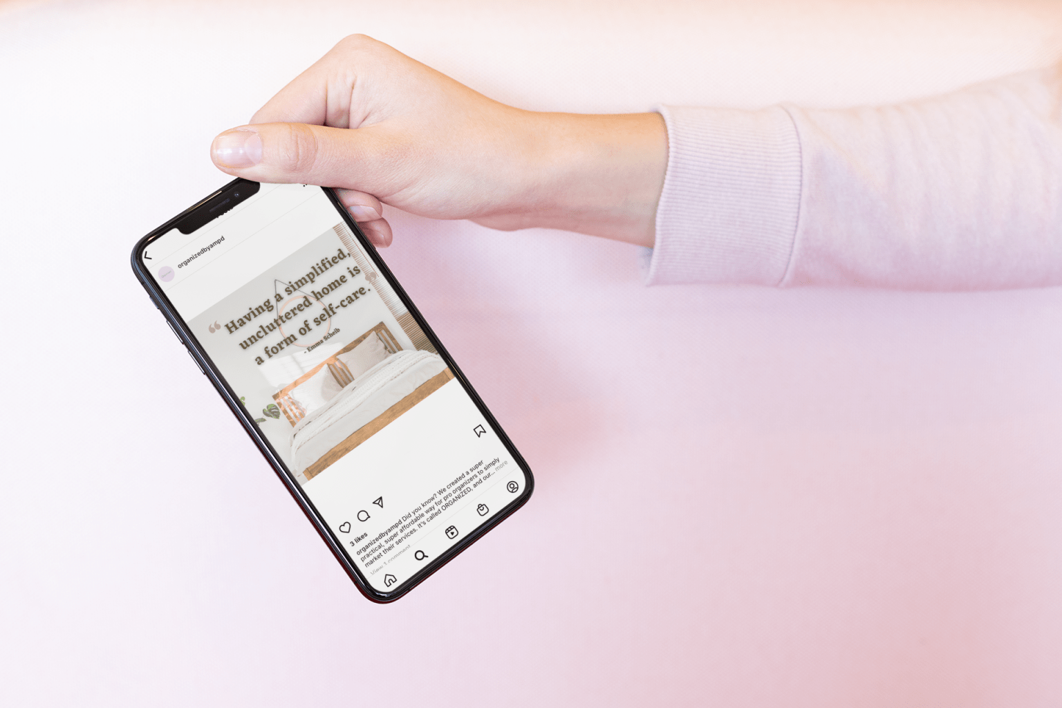 mockup of a girl holding an iphone xs by the upper corner 25437